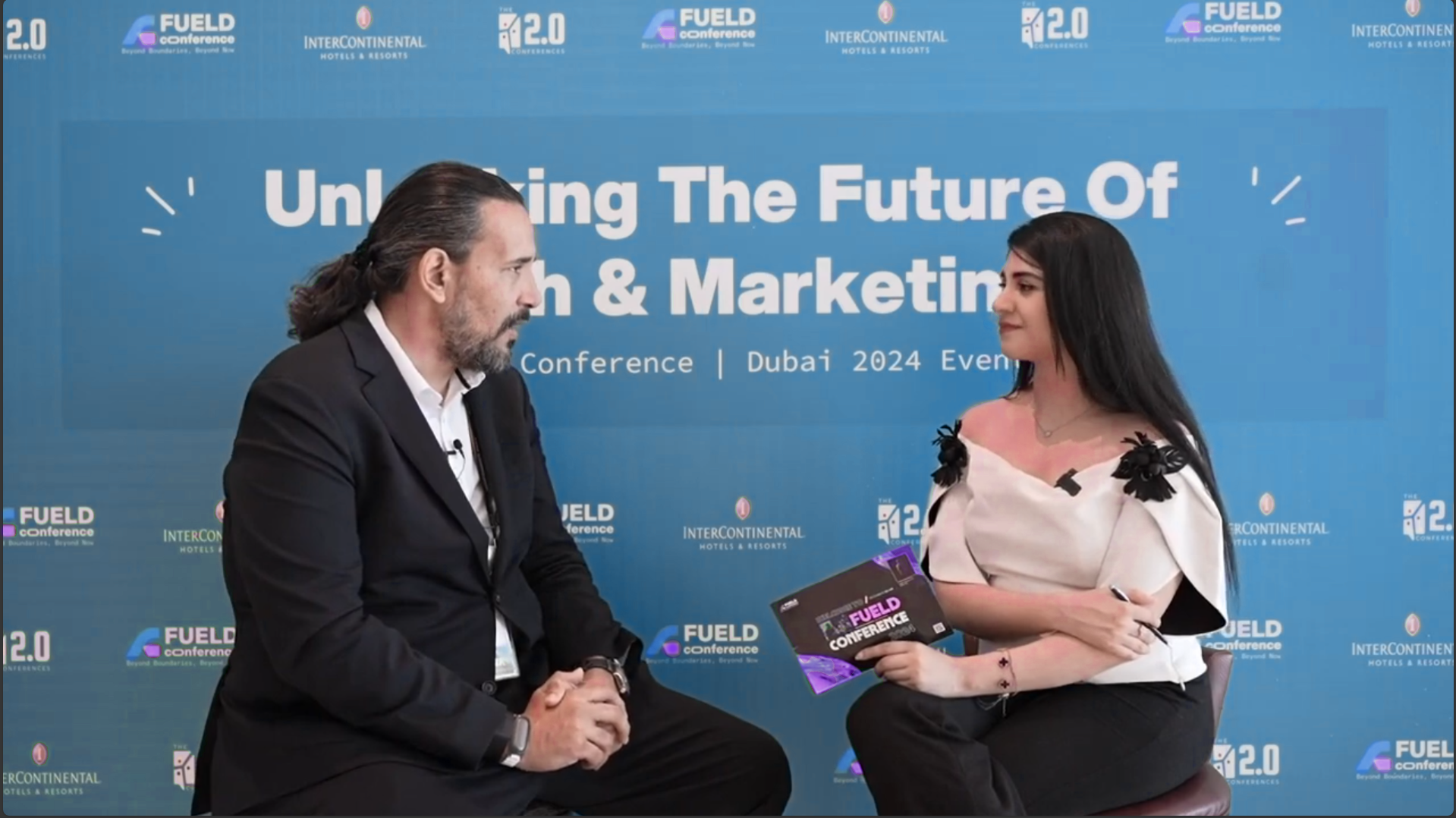 Two women engaged in conversation at conference